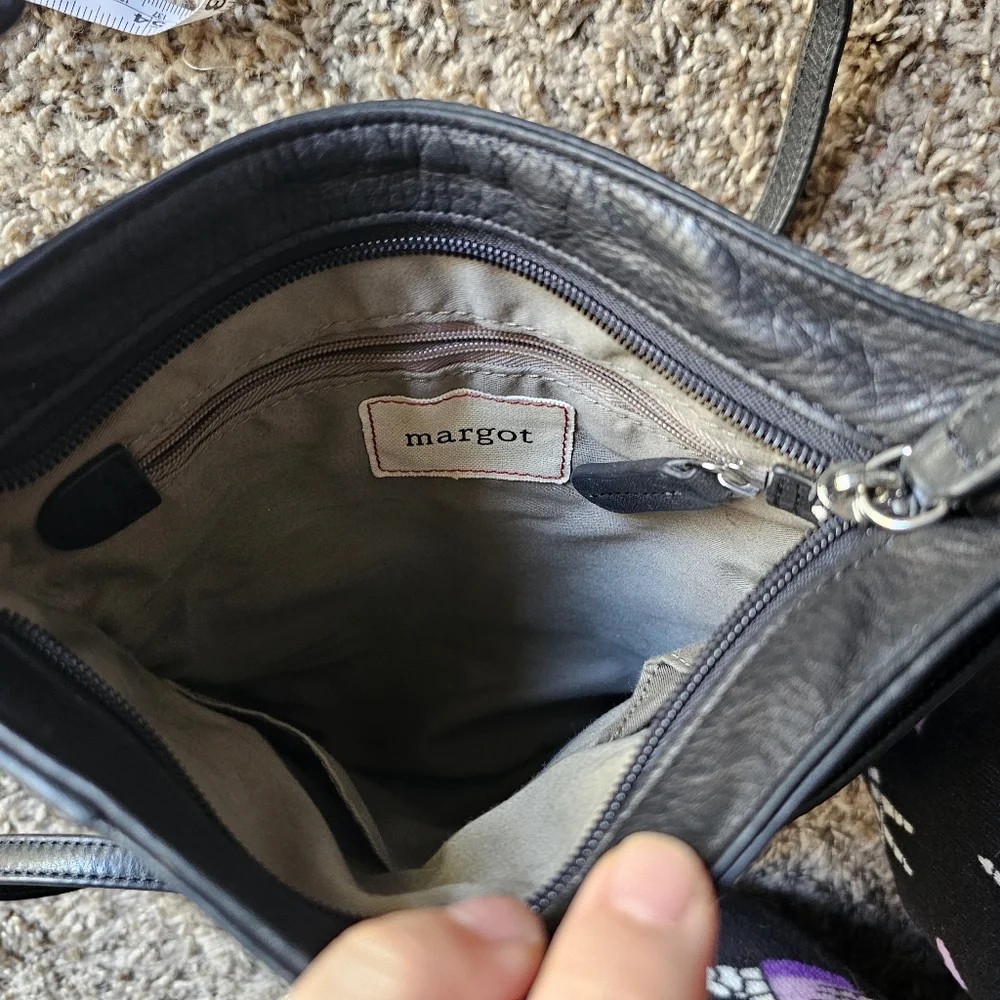 Margot black leather crossbody bag with corner pocket on‎ a front